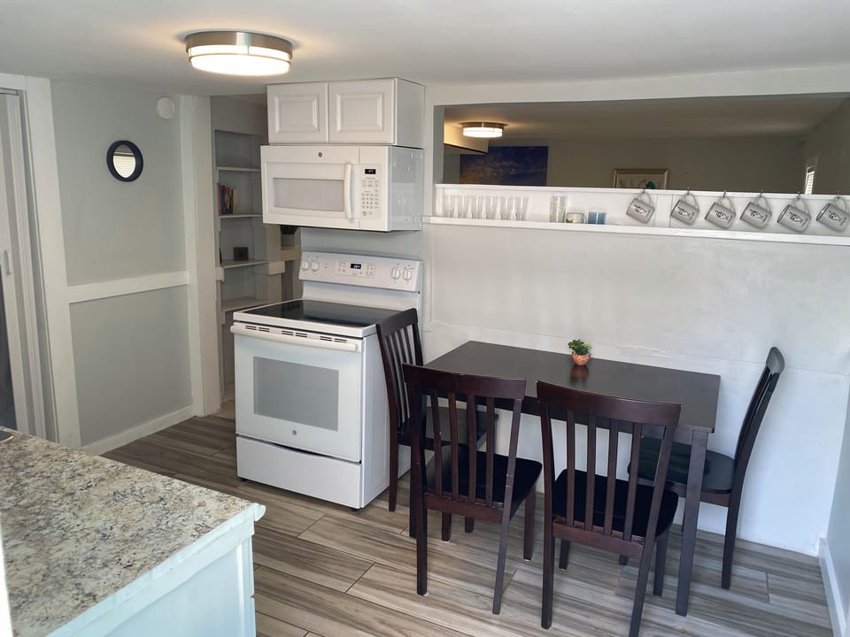 Your bright, modern kitchen awaits with granite counters, full appliances, and a cozy dining nook for memorable meals together.