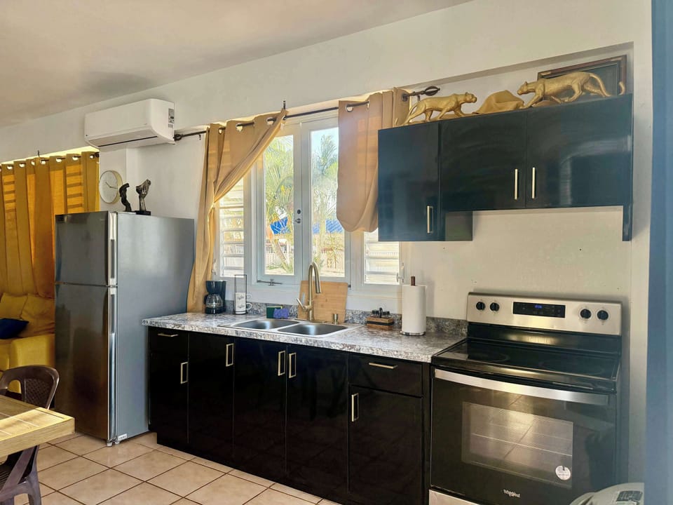 Fully equipped kitchen with modern appliances, ready for all your culinary creations.