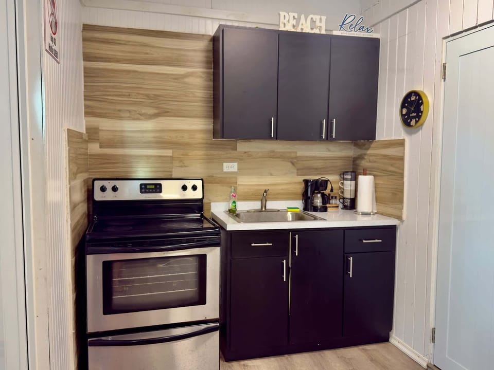 Whip up meals in the well-equipped kitchen featuring a full stove and oven.
