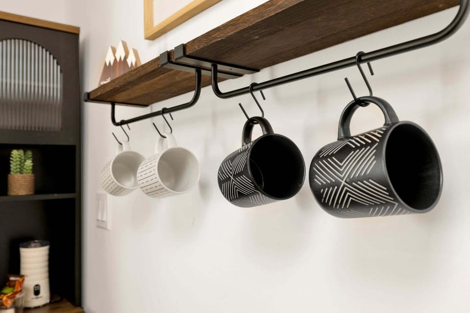 Coffee mugs next to coffee cart for your morning coffee.