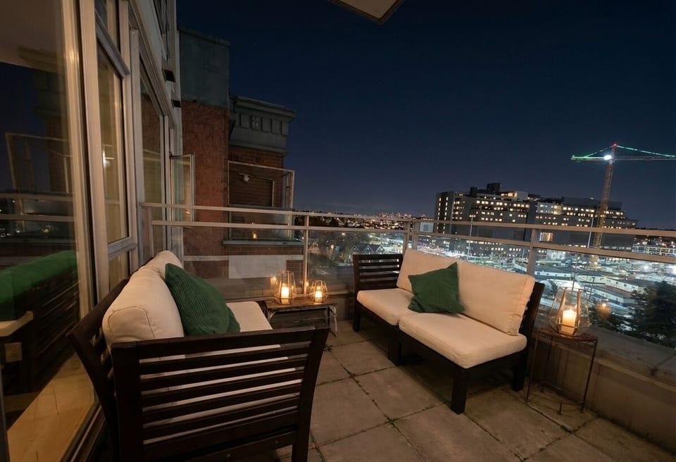 Spacious private patio with cozy seating and ambient lighting.
