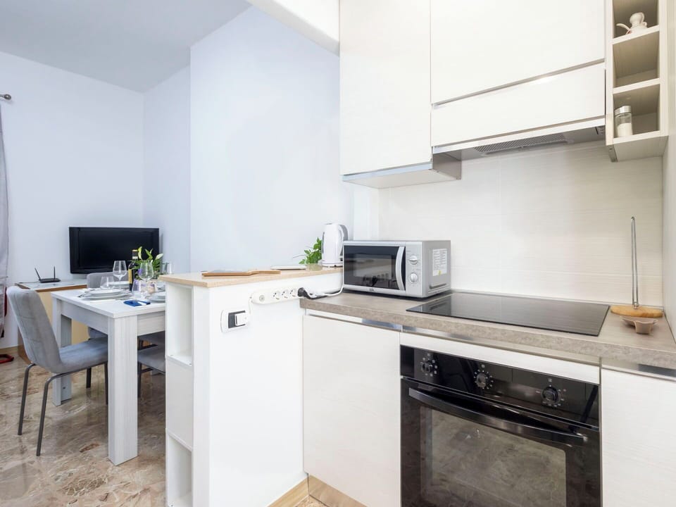 Kitchen, Furniture, Kitchen Appliance, Major Appliance, Interior Design, Countertop, Flooring, Wood, Cabinetry, Floor