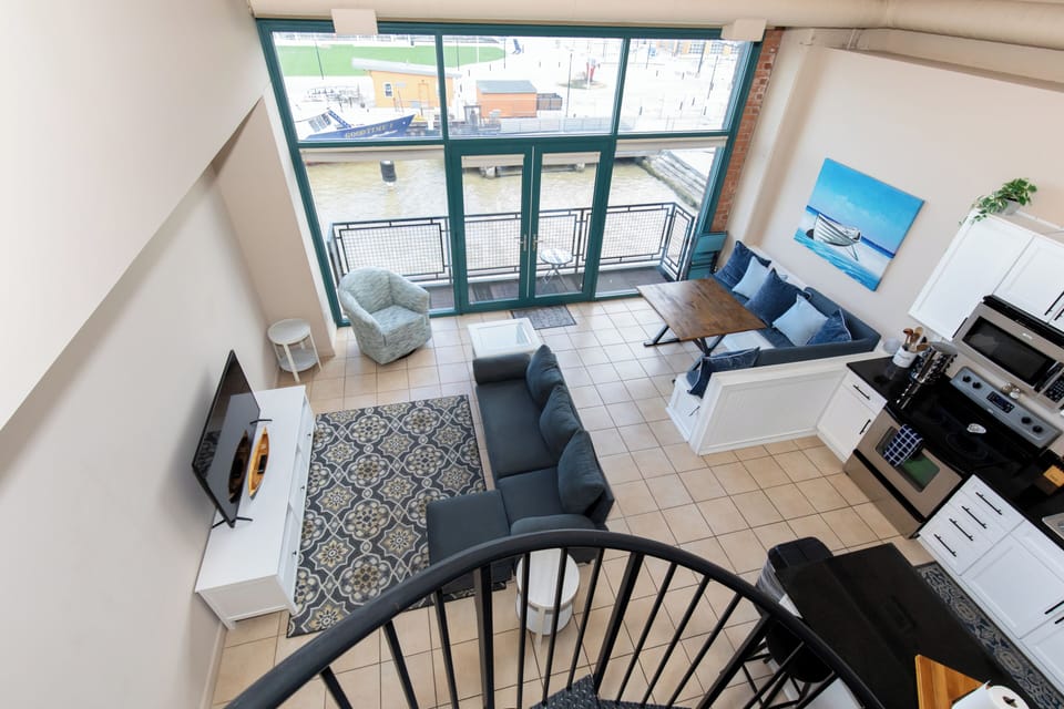 Relax in your stylish loft with stunning water views, cozy seating, and modern kitchen—perfect for unwinding after exploring the city.