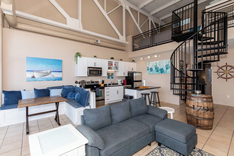 Unwind in your stylish loft with soaring ceilings, nautical touches, and an open layout perfect for relaxation.