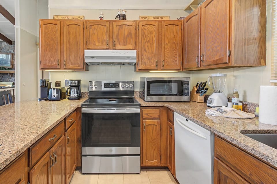 Your fully equipped kitchen awaits with granite counters, stainless appliances, and everything you need to create memorable meals together.