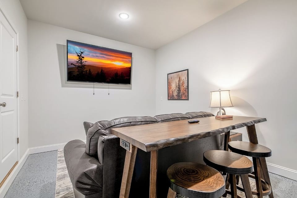 Gather around your rustic dining table for meals and conversations, with a flatscreen TV for entertainment during cozy evenings together.