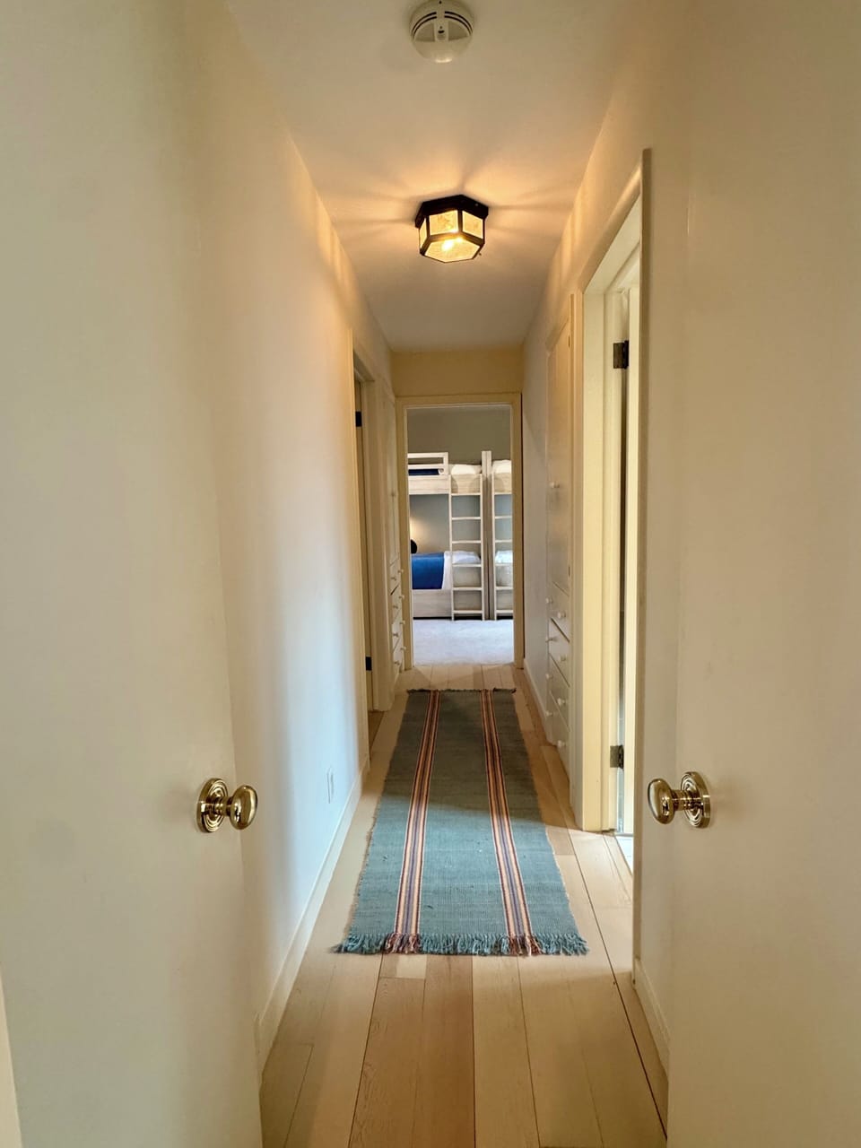 Guest wing - Bunkroom with 4 full beds, King bedroom, shared bathroom.