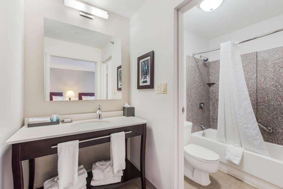 Refresh at the wide vanity before a soothing hot shower.