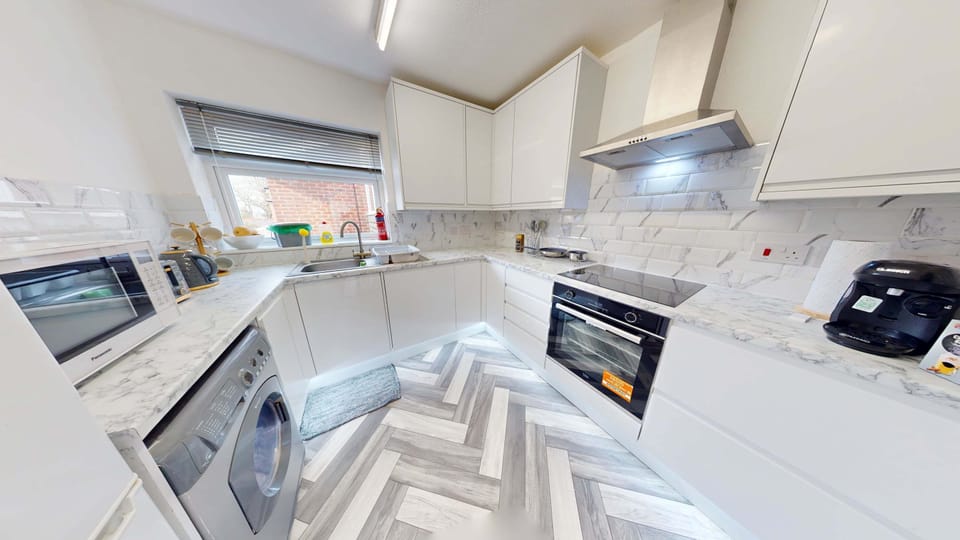 Modern Kitchen: Whip up delicious meals in this stylish space with sleek appliances and bright views!