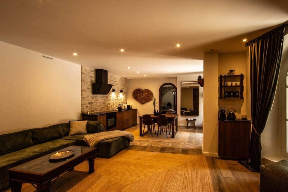 Open living area with kitchen, dining space, and lounge