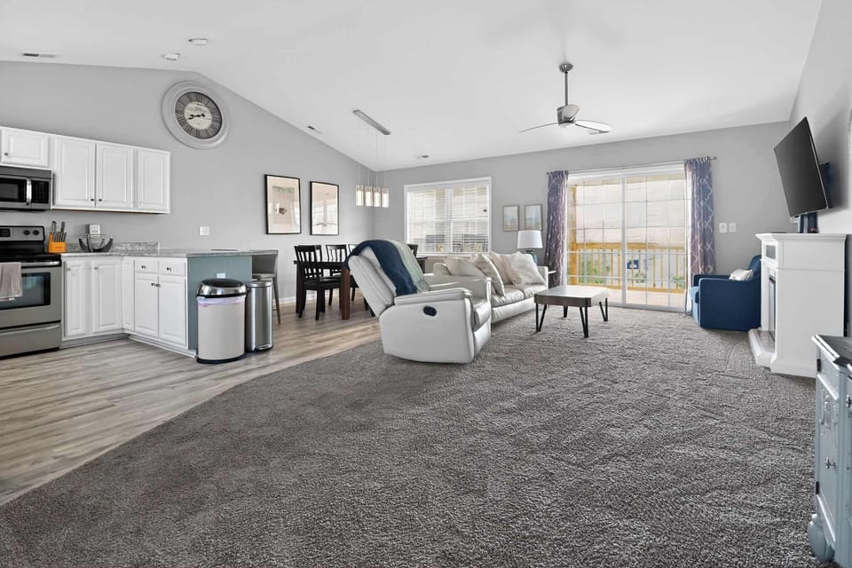 Open-concept living at its finest: modern kitchen, dining, and a cozy lounge all in one sun-drenched space.