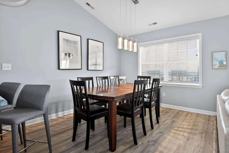 Gather the whole group around this beautiful wood-inlay table for a home-cooked meal, a lively board game, or a toast to your vacation.