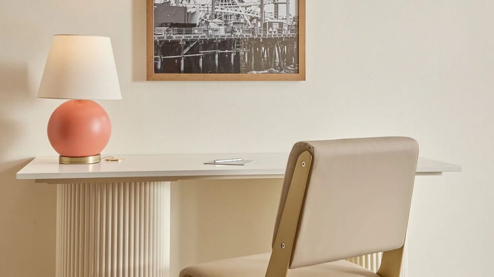 Recharge beside elegant lighting and lush, resort-style wall panels.