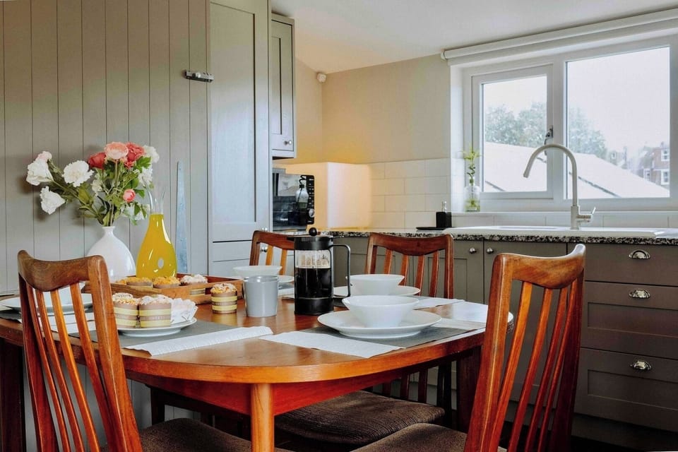 Kitchen and dining with table and essentials