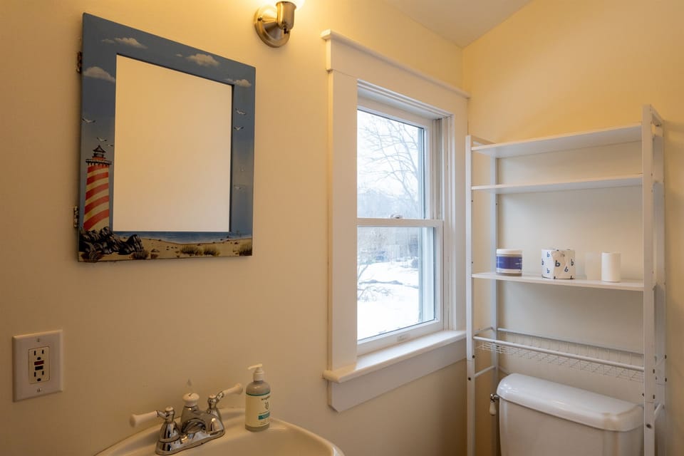 Sink and toilet in first floor full bath