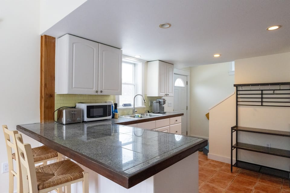 Kitchen and stairs leading to second level