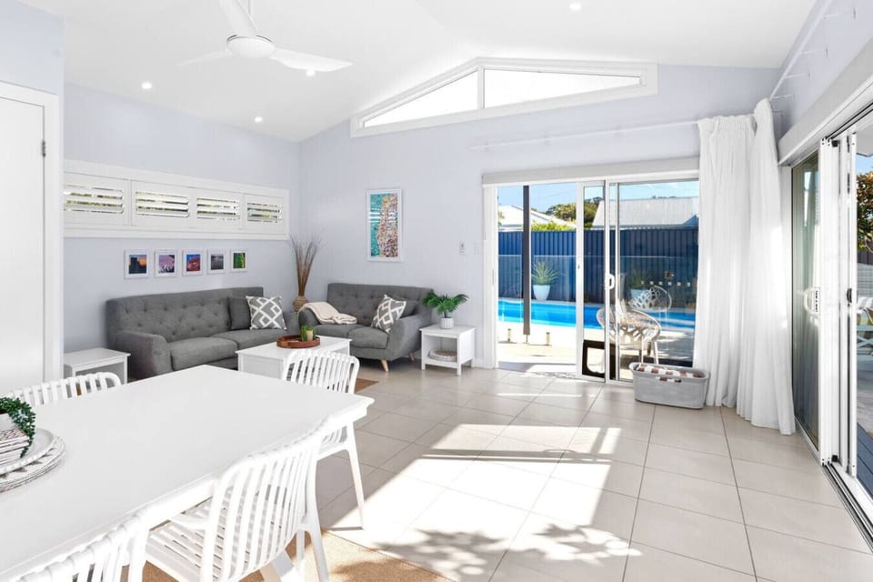Dining and seating area leading to pool