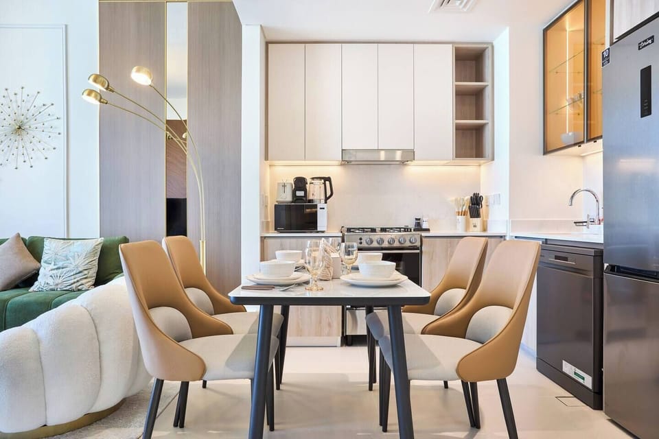 Dining table for four set within a minimalist kitchen