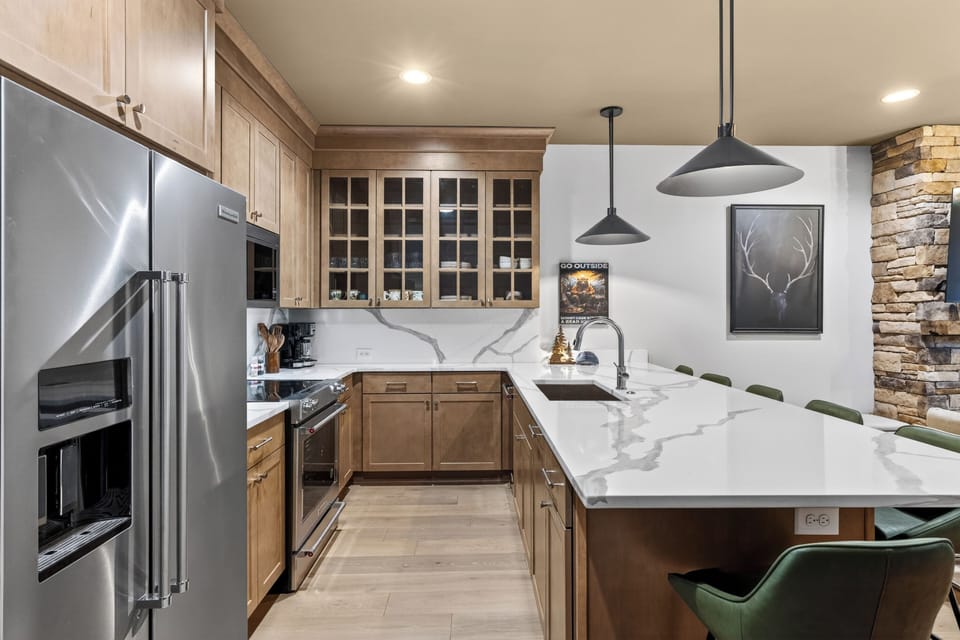 Fully equipped kitchen with a roomy island—grab a seat at the breakfast bar and keep the conversation going. (The Lodge)