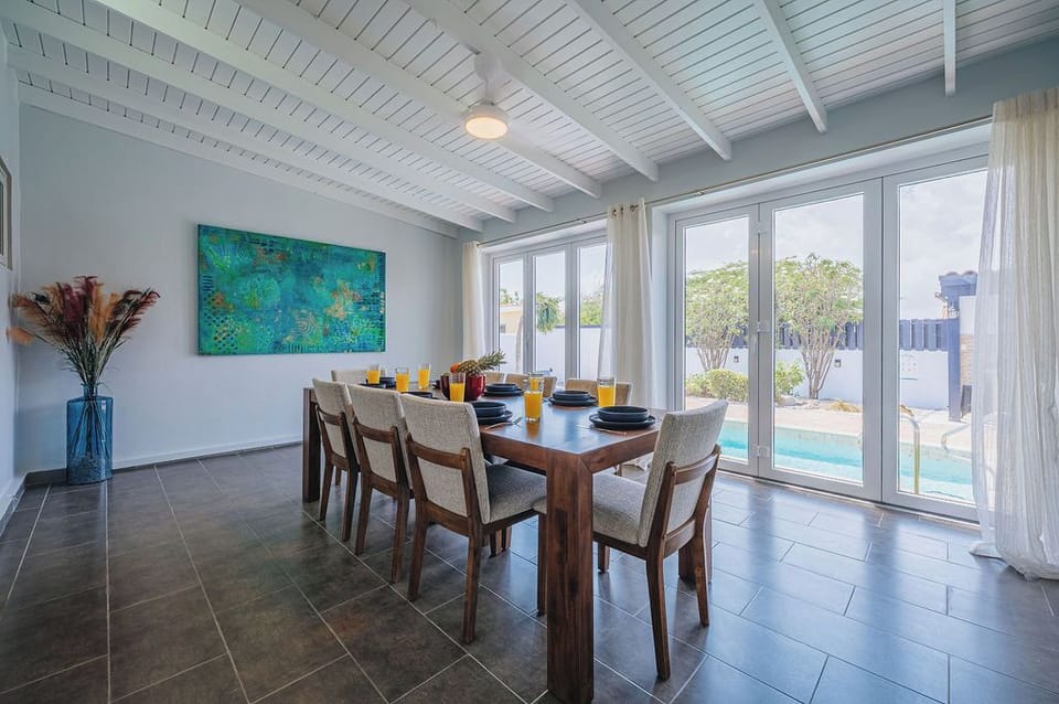 Bright dining space with direct access to the pool area.