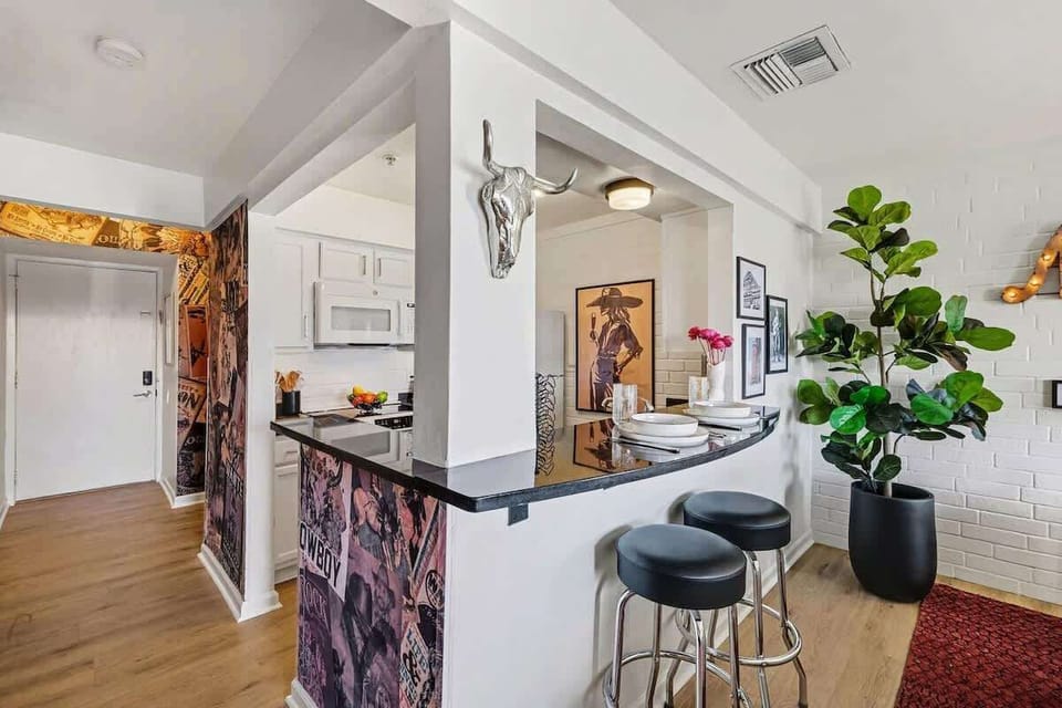 Fully equipped kitchen with stainless-steel appliances, ample counter space and bar seating for 2 guests.