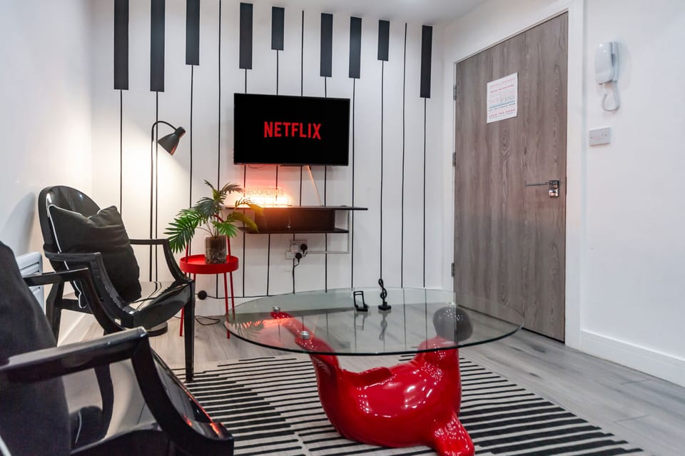 A stylish living room inspired by music in a quiet, private ground-floor apartment.
