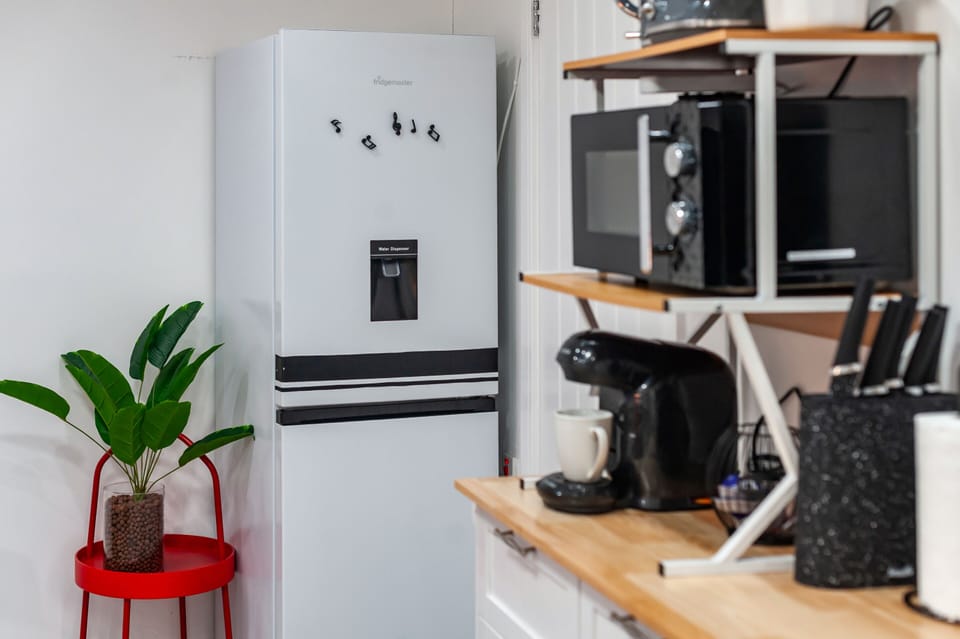 A fully equipped kitchen with all essential appliances makes this accommodation perfect for your stay.