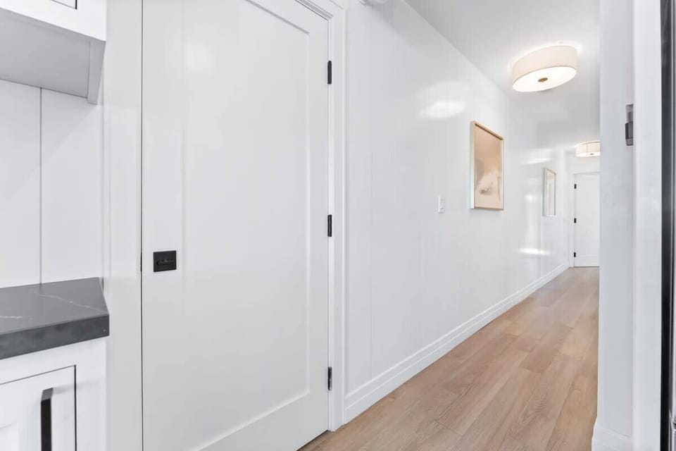 
Well-lit hallway leading to the bedrooms.