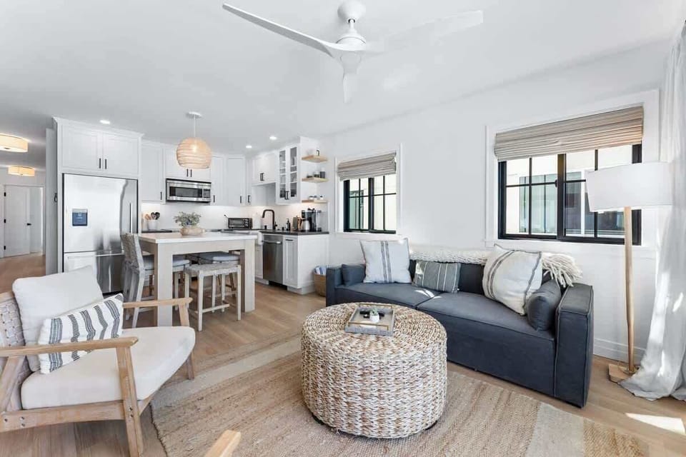 The neutral color palette of the space reflects the hues of the sea and sand outside.