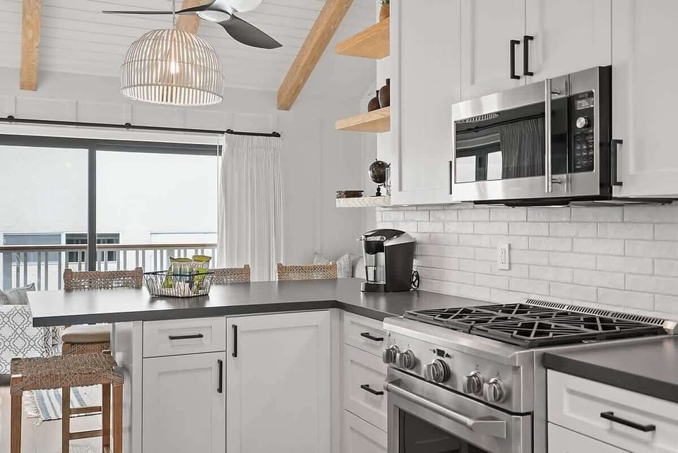 The kitchen is equipped with premium appliances and modern fixtures.