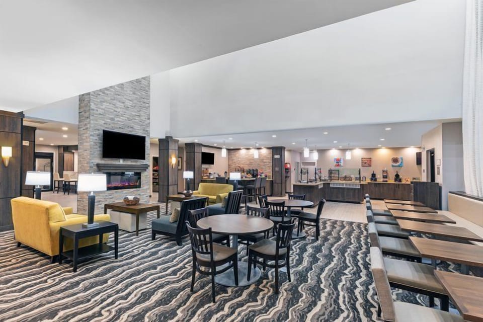 Relax in the cozy lounge area, complete with comfy seating and a warm ambiance.