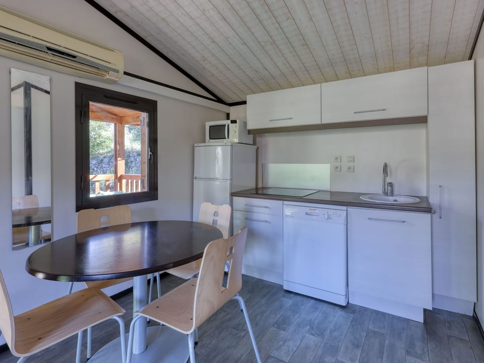 Cook up a storm in this fully equipped kitchen, complete with modern appliances and a dining area.