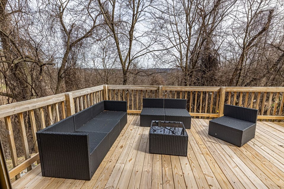 Outdoor deck with a BBQ grill, perfect for alfresco dining, morning coffee, or relaxing evenings.