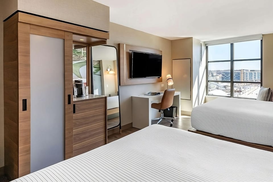 Recharge with a cozy work nook, big TV, and sunlit views.