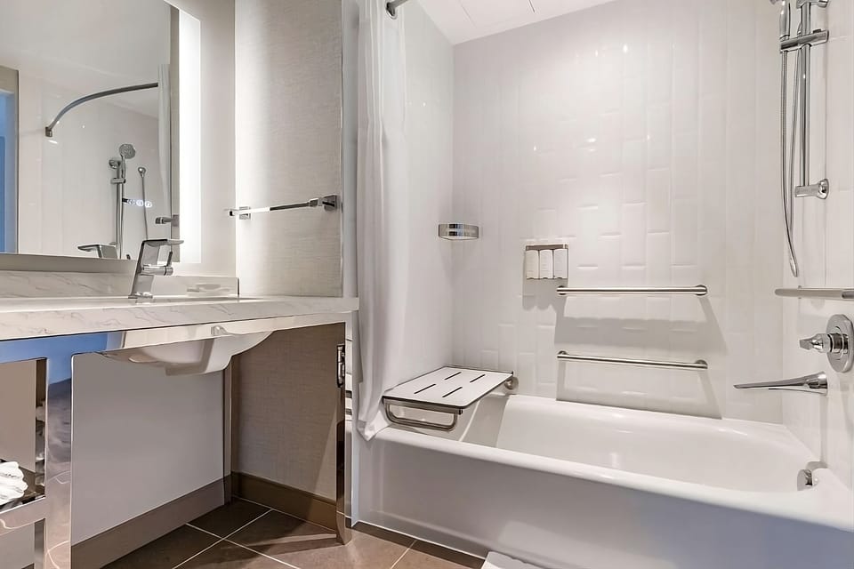 Soak and reset in a deep tub with modern fixtures.