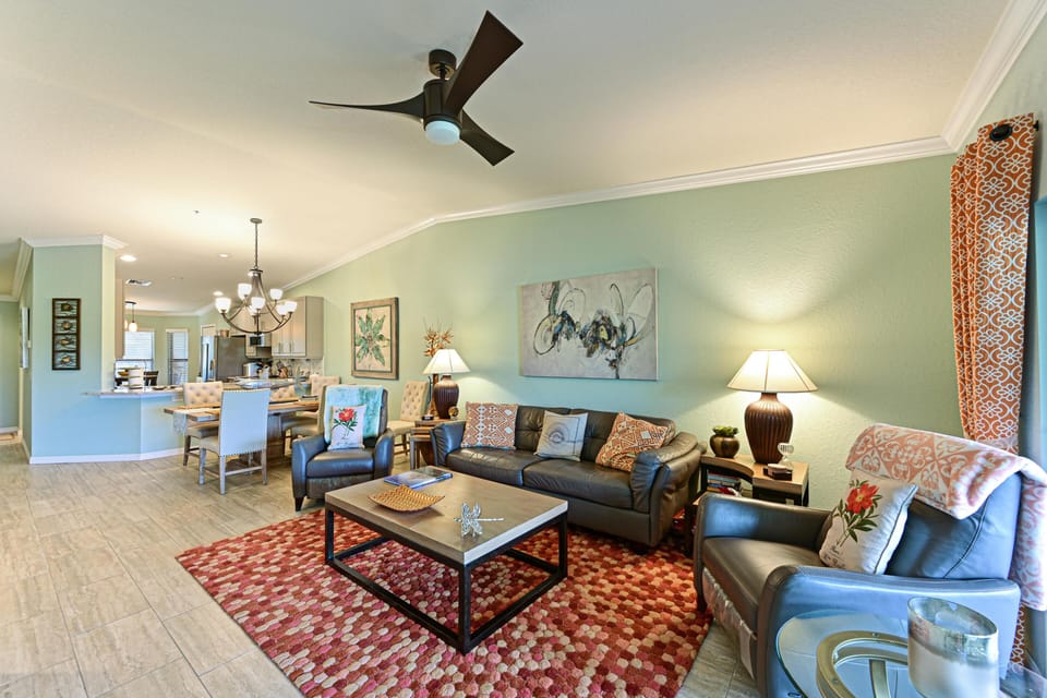 Bright living room with plush sectional and patterned rug