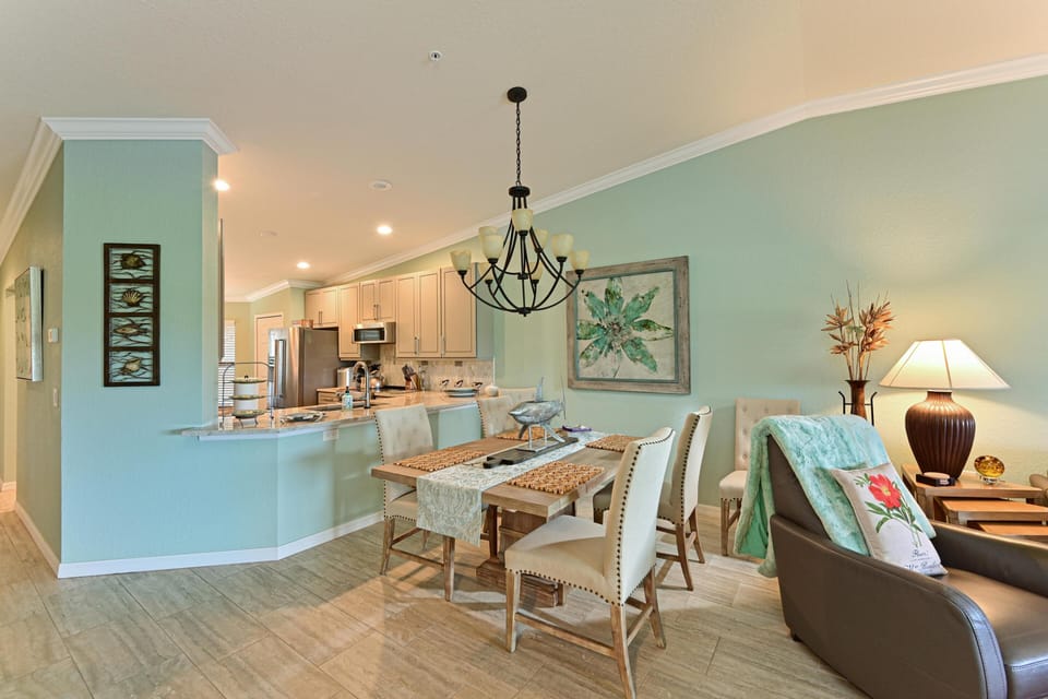 Open living and dining space with chandelier and cozy seating