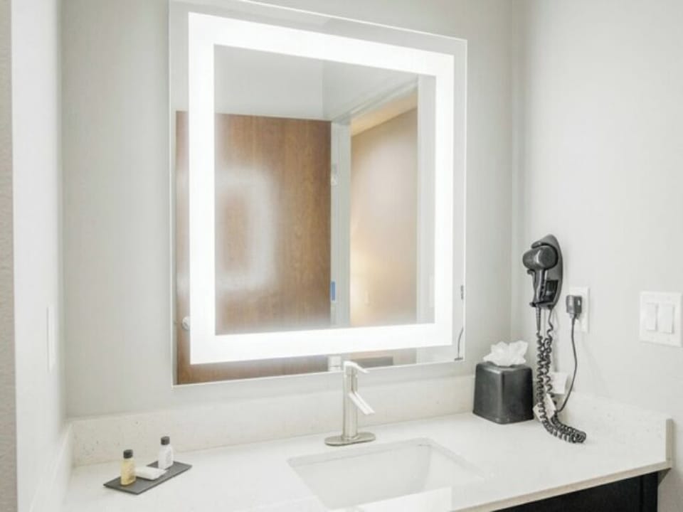 Refresh at a spotless vanity with flattering, spa-like lighting.