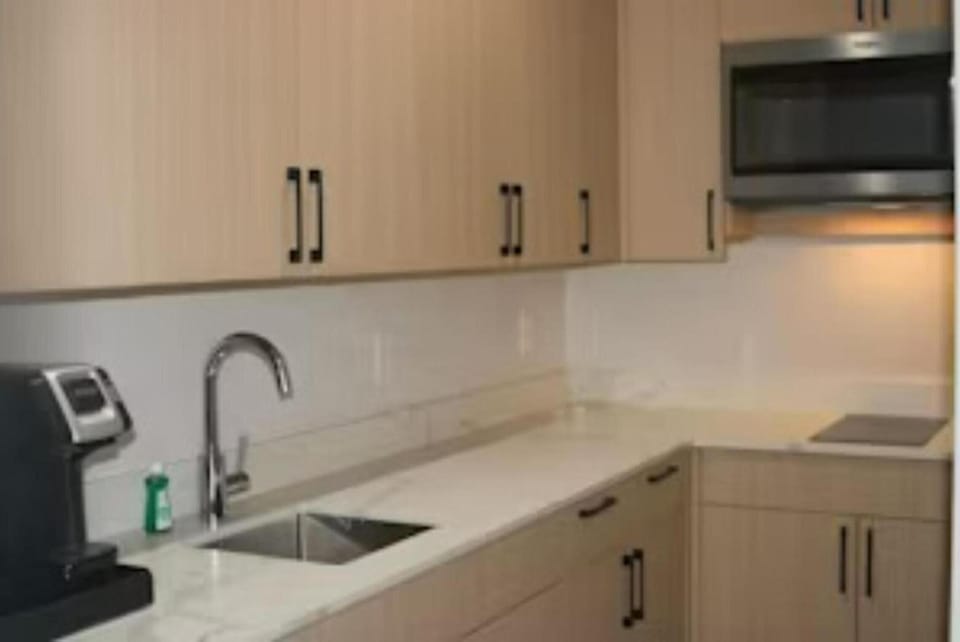 Cook with ease in a streamlined kitchenette setup.