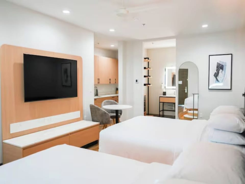 Settle in with roomy comfort, big TV, and cozy seating.