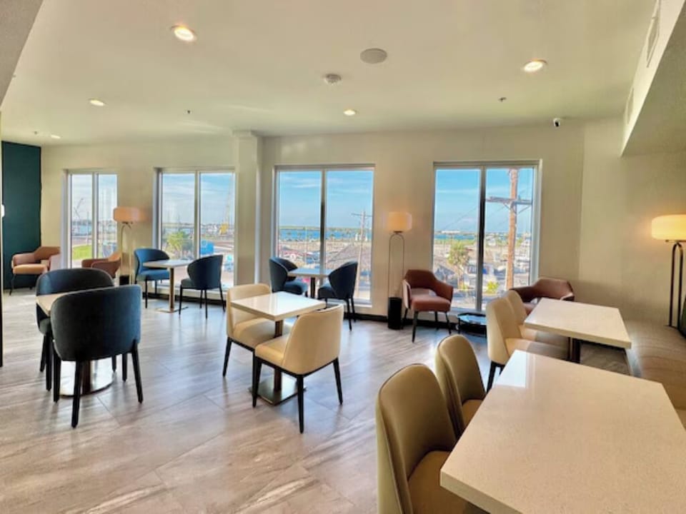 Gather for breakfast with panoramic views and airy modern seating.