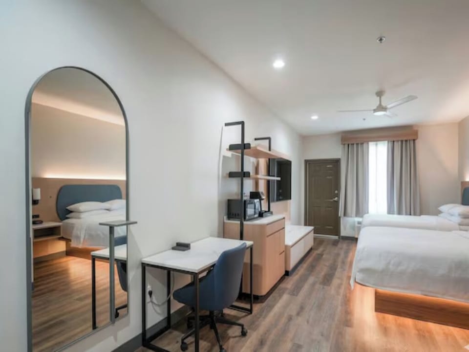 Settle in with a work desk and cozy sleeping space.