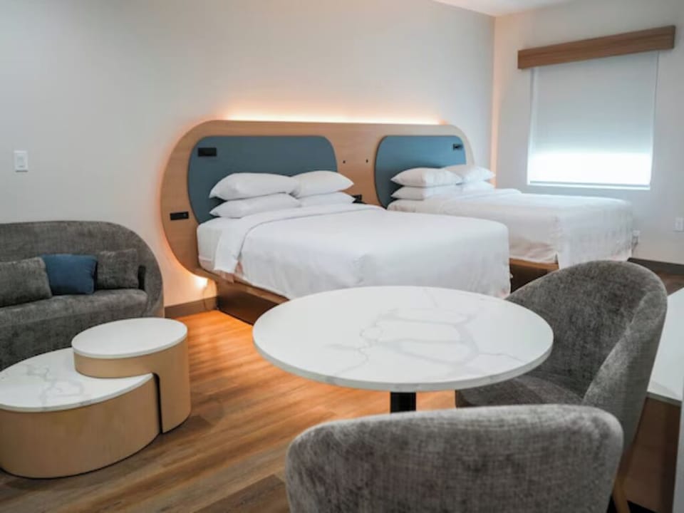 Unwind in a bright room with plush double beds.