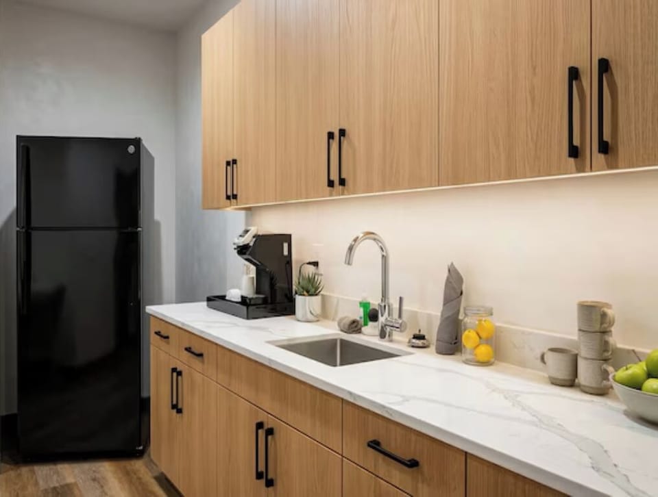 Fuel your day with a sleek kitchenette and essentials.