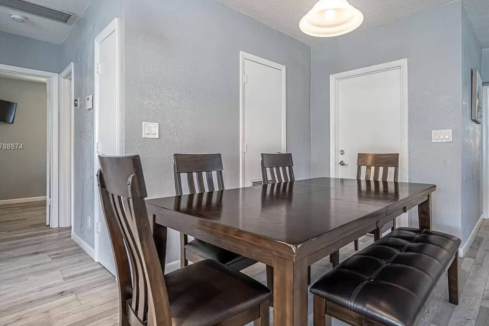 Spacious dining table for group meals, game nights, or relaxed dinners at home.