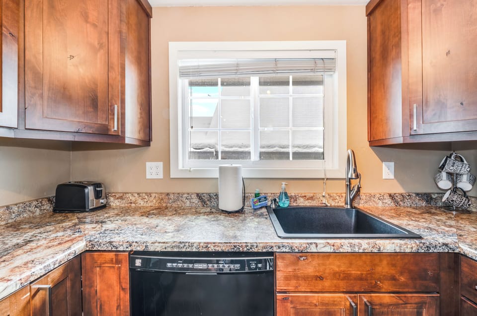 Full kitchen with all of the appliances including dishwasher