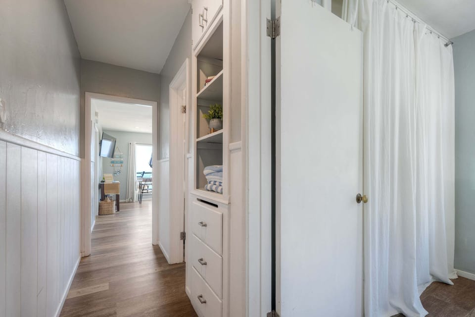 Hallway leading to bedroom and bathroom