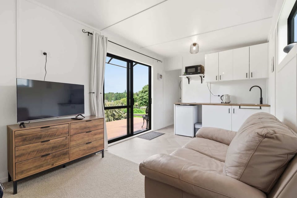 Open-plan living with deck access