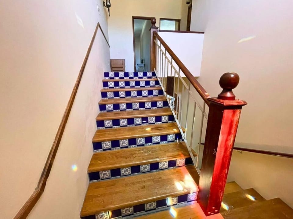 This interior staircase at Casa Barber vacation rental in San Felipe BC MX leads to the second floor — where more bedrooms and space await your group.