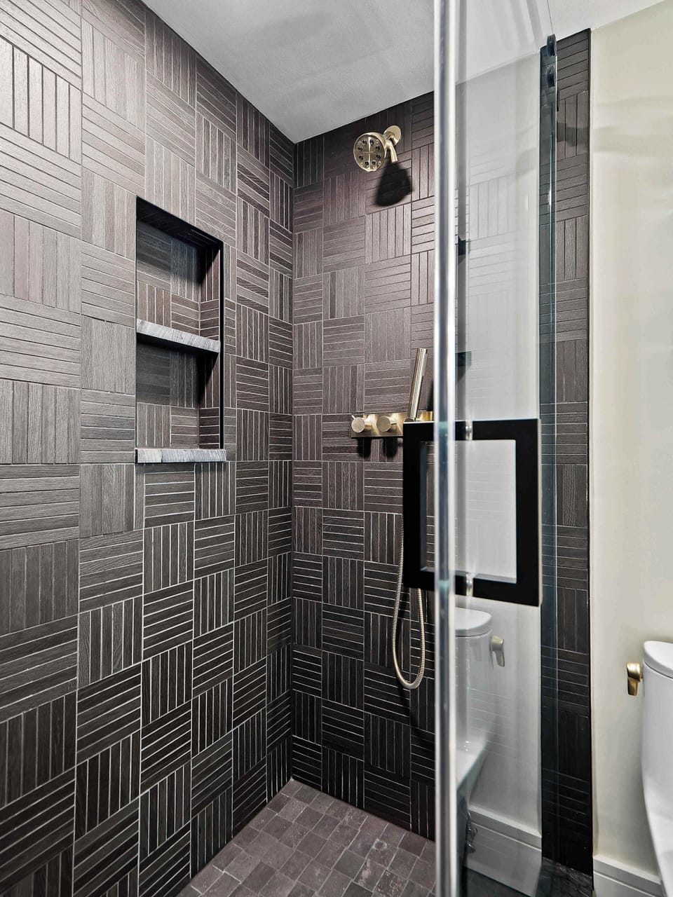 Walk-in shower w/ tiled walls & glass door for a clean, modern look